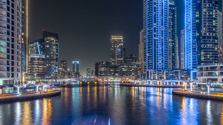 Dubai Marina towers and canal in Dubai night timelapse hyperlapseの写真素材