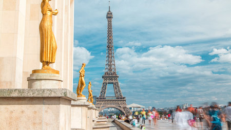 Eiffel Tower and the golden statues of women in the sun light timelapse, Trocadero square, Paris, Franceの写真素材
