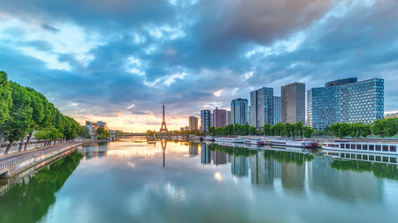 Eiffel Tower sunrise timelapse with boats on Seine river and in Paris, France.の写真素材