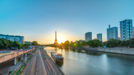 Eiffel Tower sunrise timelapse with boats on Seine river and in Paris, France.の写真素材