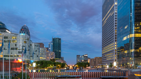 Paris cityscape with modern buildings in business district La Defense day to night timelapse. Paris, Franceの写真素材