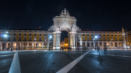 Triumphal arch at Rua Augusta at Commerce square night timelapse hyperlapse in Lisbon, Portugal.の写真素材