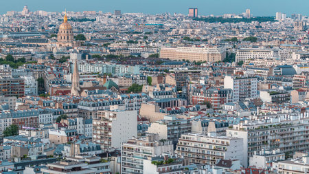 Aerial panorama above houses rooftops in a Paris day to night timelapseの写真素材