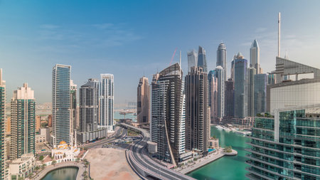 Aerial view of Dubai Marina residential and office skyscrapers with waterfront timelapseの写真素材
