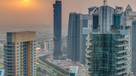 Aerial top view of sunrise in Dubai Marina timelapse. Modern towers and traffic on the roadの写真素材