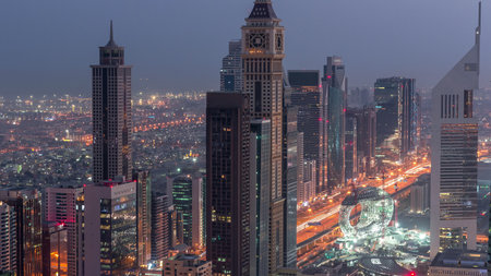 Skyline of the buildings of Sheikh Zayed Road and DIFC aerial night to day timelapse in Dubai, UAE.