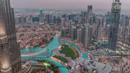 Amazing aerial view of Dubai downtown skyscrapers day to night timelapse, Dubai, United Arab Emiratesの写真素材