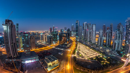 Panorama of Business bay Dubai night to day aerial timelapse.の写真素材
