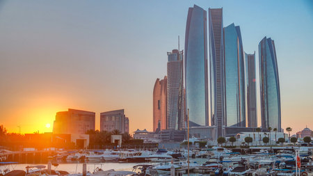 Al Bateen marina Abu Dhabi timelapse with modern skyscrapers on backgroundの写真素材