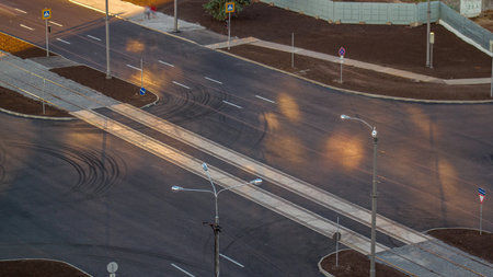 Aerial view with a new asphalt road under construction.