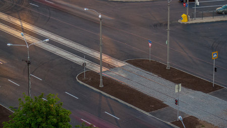Aerial view with a new asphalt road under construction.