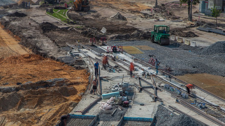Repair works on the street timelapse. Laying of new tram rails on a city streetの写真素材