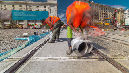 Tram rails at the stage of their installation and integration into concrete plates on the road timelapseの写真素材