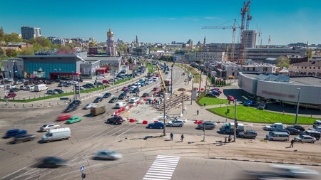 Installing concrete plates by crane on intersection at road construction site timelapse.の写真素材