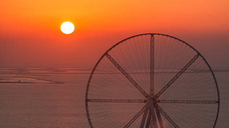 Bluewaters island at sunset aerial timelapse with ferris wheelの写真素材
