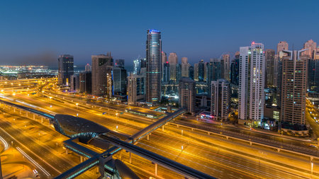 Dubai Marina skyscrapers aerial top view before sunrise from JLT in Dubai night to day timelapse, UAE.の写真素材