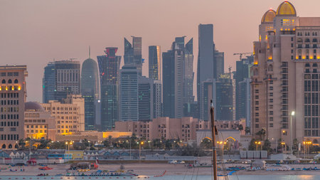 View from Katara Beach day to night timelapse in Doha, Qatar, towards the West Bay and city centerの写真素材