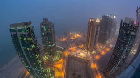 The skyline of the West Bay area from top in Doha day to night timelapse, Qatar.