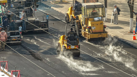 Large view on the road rollers working on the new road construction site timelapse
