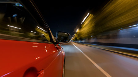 Drivelapse from side of car moving on a night avenue in city timelapse hyperlapseの写真素材