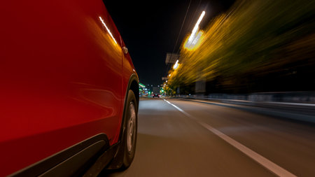 Drivelapse from side of car moving on a night avenue in city timelapse hyperlapseの写真素材