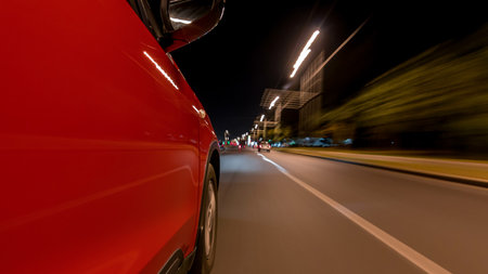 Drivelapse from side of car moving on a night avenue in city timelapse hyperlapseの写真素材