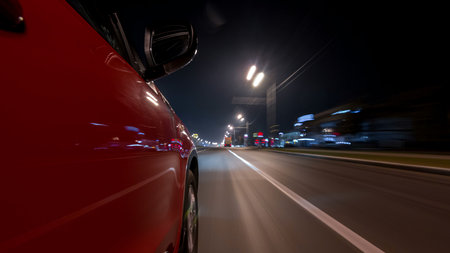 Drivelapse urban look from fast driving car at a night avenue in a city timelapse hyperlapse