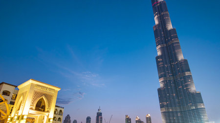 Bridge and fountains with Burj Khalifa day to night transition, Dubai, Emirates timelapseの写真素材