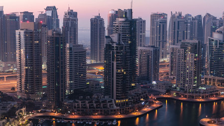 Dubai marina harbor panorama from night to day transition timelapseの写真素材