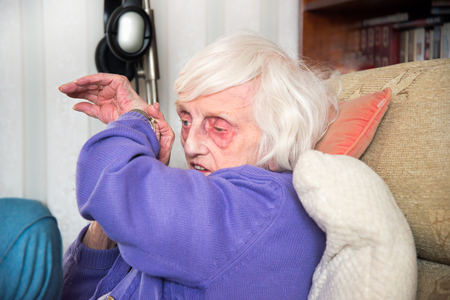 A blind 90 year old lady,with severe macular de-generation can only tell the time by listening to her talking watch.の写真素材
