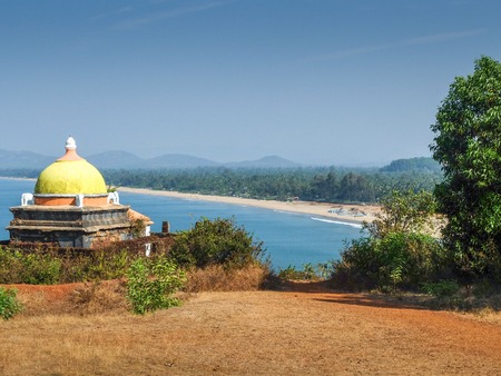 View from cliffs at southern end of the main beach,with small shrine overlooking.の写真素材