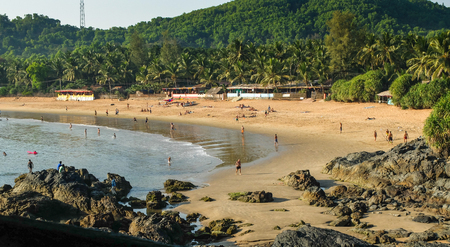 Tourists and travelers enjoying the sun,sea and leisure activities at this increasingly popular beach in India. IIndiauthwestern India.の写真素材
