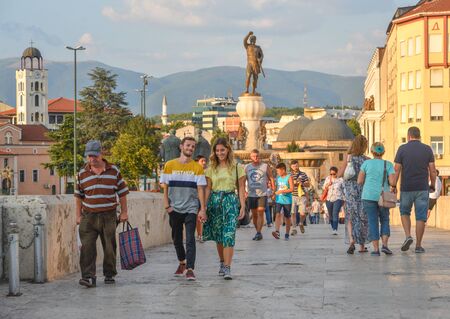 SKOPJE,NORTH MACEDONIA/AUGUST 22 2018: Pedestrians walk across Stone Bridge in the city center.Skopje,north Macedonia.のeditorial素材