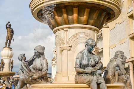 SKOPJE,REPUBLIC OF NORTH MACEDONIA-AUGUST 27 2018:Water jets squirting in front of statues at a fountain in the old quarter of the city.のeditorial素材