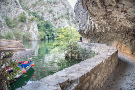 At Matka Canyon,near Skopje visitors can walk the pathway running next to the river and the waters of Matka lake.のeditorial素材