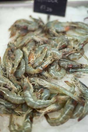 Closeup of uncooked shrimp freshly arranged on a bed of crushed ice,at Kotor's main market along the quayside at Kotor Bay.の写真素材