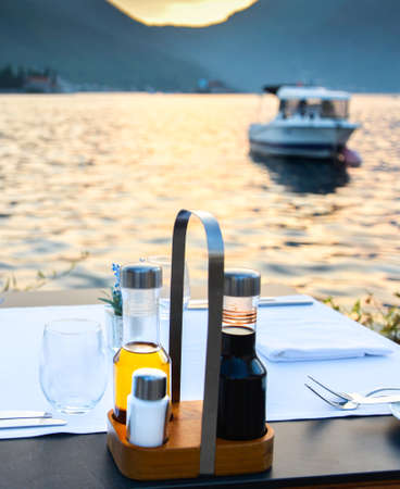 A beautiful romantic tourist destination by the edge of Kotor Bay in late summer with...