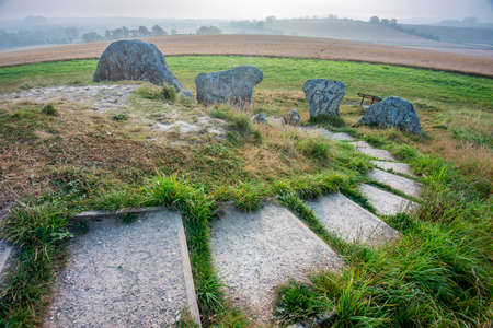 Steps leading down from the top of the Ancient Neolithic burial chambers and historic landmark,built 3650 years BC in the southwest of England.の写真素材