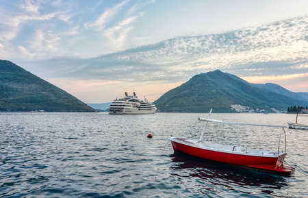 In the summertime,boats float on the calm waters of this coastal tourist town not far from Kotor.のeditorial素材