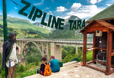 Durmitor,Montenegro-September 8th 2019:Next to Tara Bridge,people pay for thrills to fly across the Canyon along steel cable,high over the river below.のeditorial素材