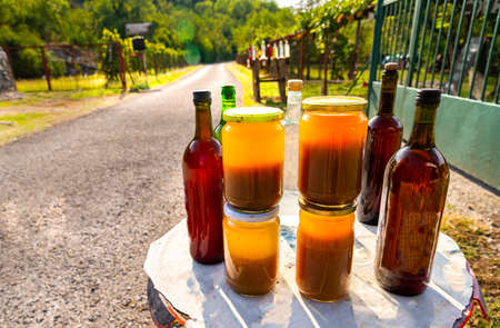 Produced from bee hives kept in the garden and wine from grapes grown around the fences surrounding a house. The climate of Montenegro perfect for this.の写真素材