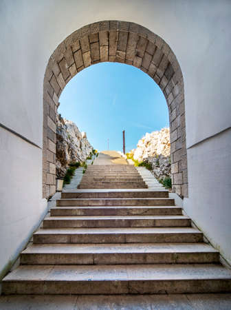Lovcen National park. Dimly lit steep,white stone steps leading through a long narrow tunnel in the mountain up to the Mausoleum of Petar II Petrovic-Njegos,at the summit.のeditorial素材