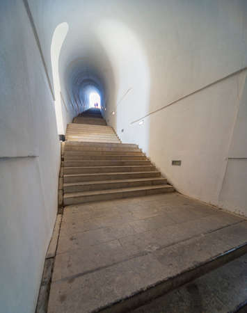 Lovcen National park. Dimly lit steep,white stone steps leading through a long narrow tunnel in the mountain up to the Mausoleum of Petar II Petrovic-Njegos,at the summit.のeditorial素材
