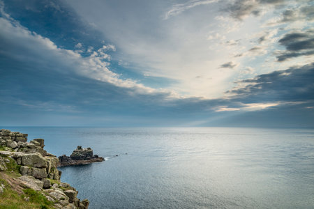 At the British mainland's westernmost point,a calm and peaceful Atlantic Ocean,high pressure,summer season clouds,a beautiful tranquil scene,looking west towards America.の写真素材