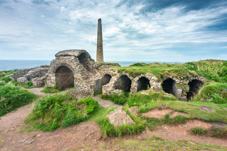 Botallack Crown tin mines,historic ruins,evidence of the tin mining industry with intact chimney entrances and various entrances into thr mines.のeditorial素材
