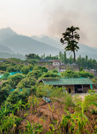 Popular travel destination,dramatic scenery,air hazy and polluted by crop burning fires,in the distant hills, seen from the popular viewing location,just outside the small town of Pai.の写真素材