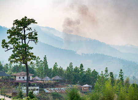 Popular travel destination,dramatic scenery,air hazy and polluted by crop burning fires,in the distant hills, seen from the popular viewing location,just outside the small town of Pai.の写真素材