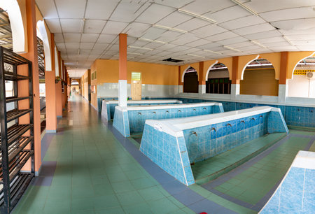 A Wadhu facility, a dedicated area for ritual washing before prayer. an ablution space for...