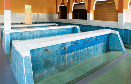 A Wadhu facility, a dedicated area for ritual washing before prayer. an ablution space for...