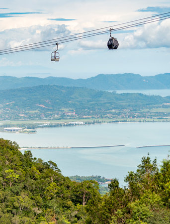 Running high over the forested peaks of Mat Cincang,the second highest mountain in Langkawi,a major tourist destination, with awesome views across the island, and location of the Langkawi Sky Bridge.の写真素材